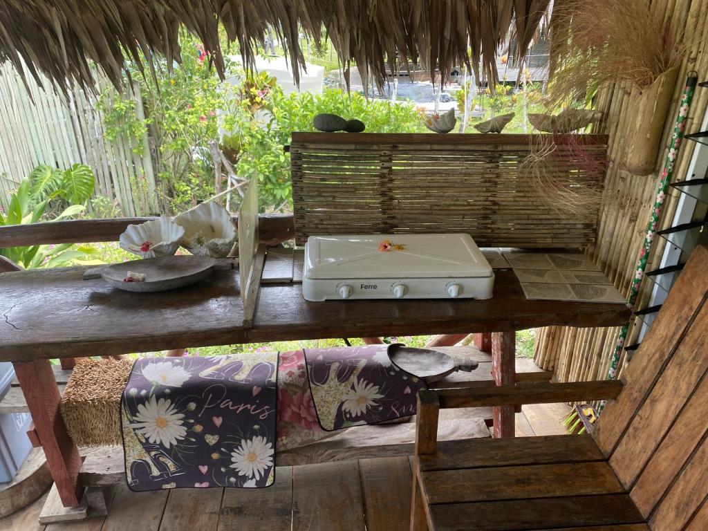 a table with a laptop computer on top of it at Port-Olry Beach Bungalows Chez Louis in Port Olry