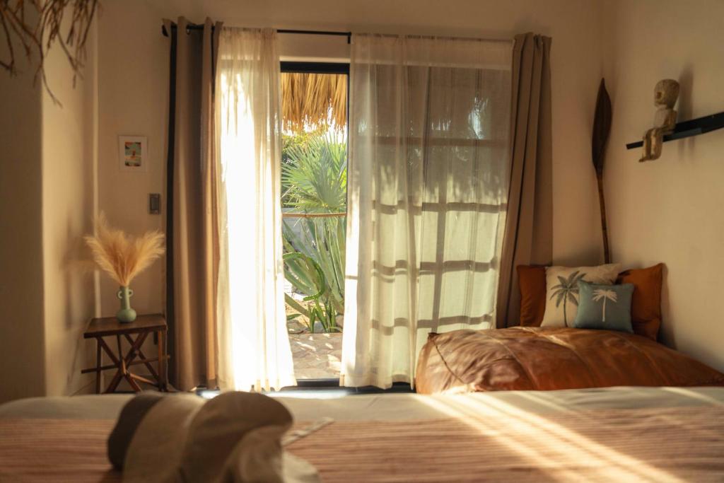 Postel nebo postele na pokoji v ubytování Casa MexiBali, Suite Mexi
