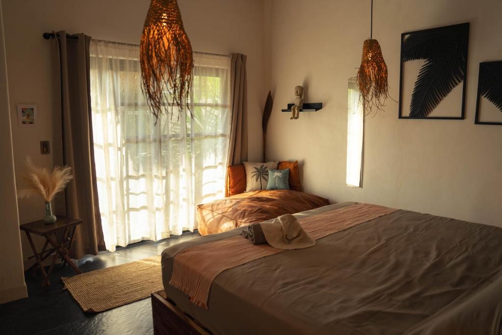 Postel nebo postele na pokoji v ubytování Casa MexiBali, Suite Mexi