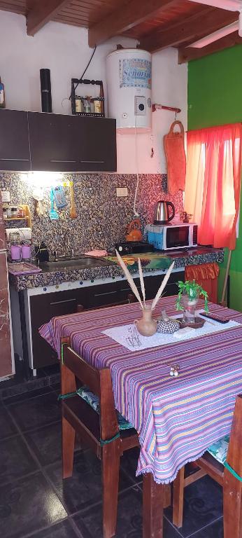 a kitchen with a table with a table cloth on it at tranquilidad absoluta in Villa Unión