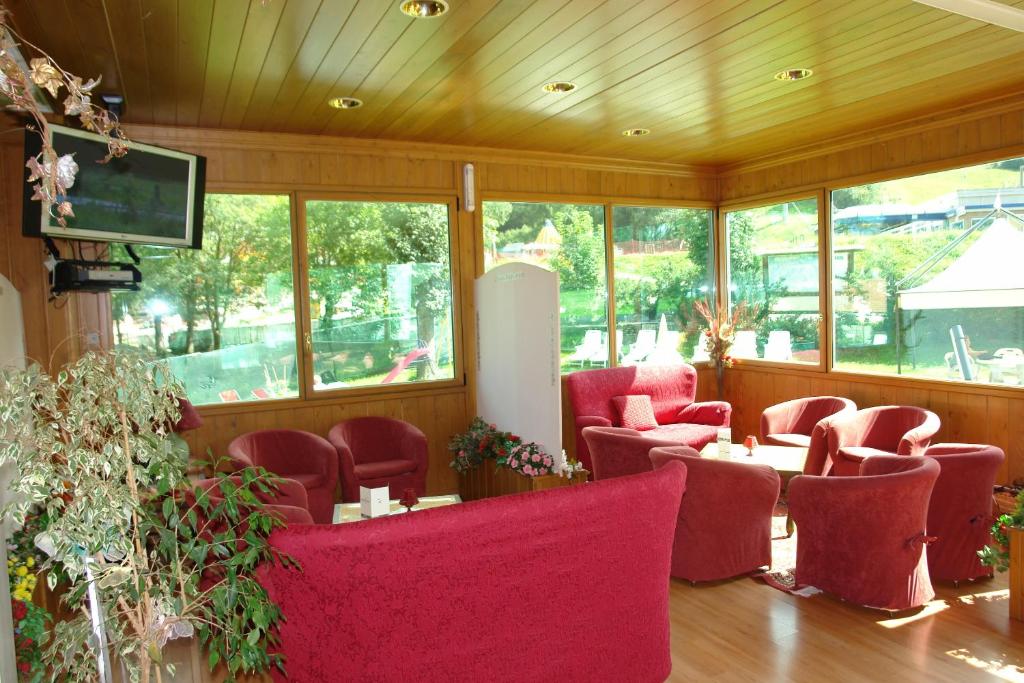 TV a/nebo společenská místnost v ubytování Hotel Club Funivia