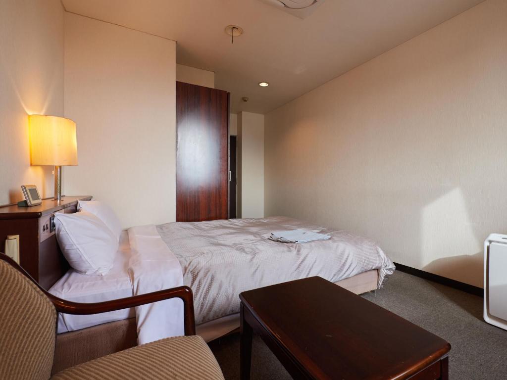 Postel nebo postele na pokoji v ubytování Tabist Hotel New Central