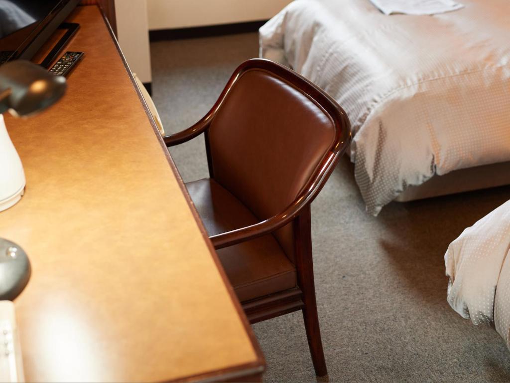 Postel nebo postele na pokoji v ubytování Tabist Hotel New Central
