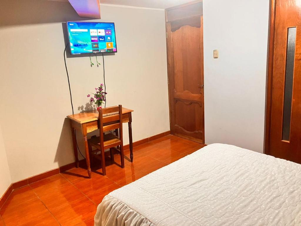 Postel nebo postele na pokoji v ubytování Hostal El Rancho