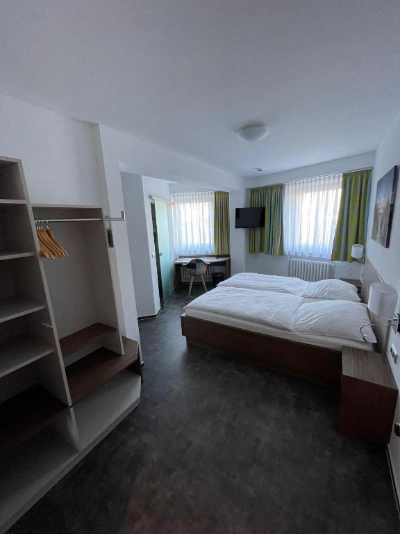 Postel nebo postele na pokoji v ubytování Hotel Meyer