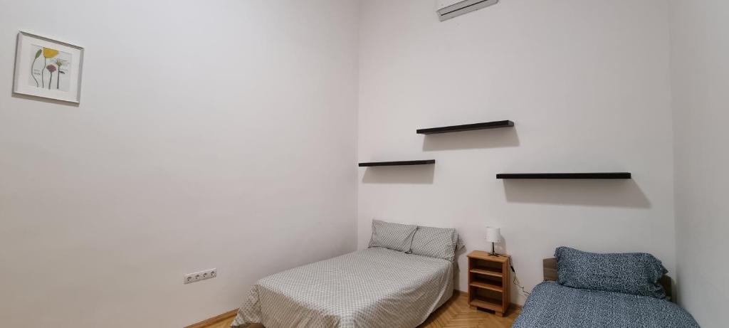 Postel nebo postele na pokoji v ubytování Lookery Apartment