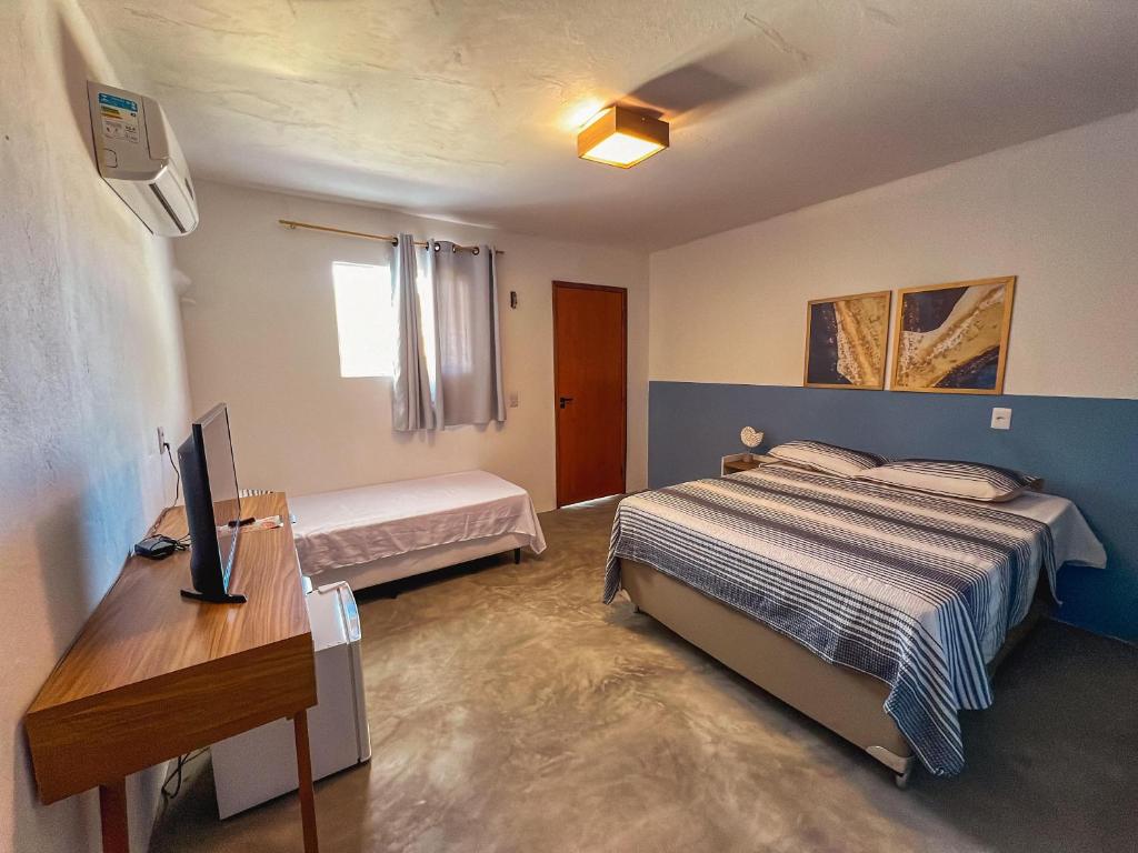 Postel nebo postele na pokoji v ubytování Dlux Suites Baia Formosa
