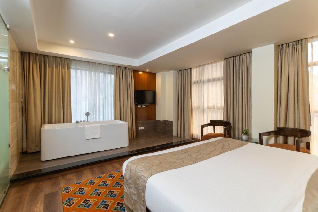 Postel nebo postele na pokoji v ubytování Hotel Shambala