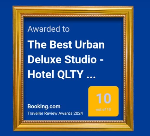 a framed sign for the best ukrainian deluxe studio hotel city at The Best Urban Deluxe - Duplex Studio - Hotel QLTY Faria Lima - by LuXXoR in Sao Paulo