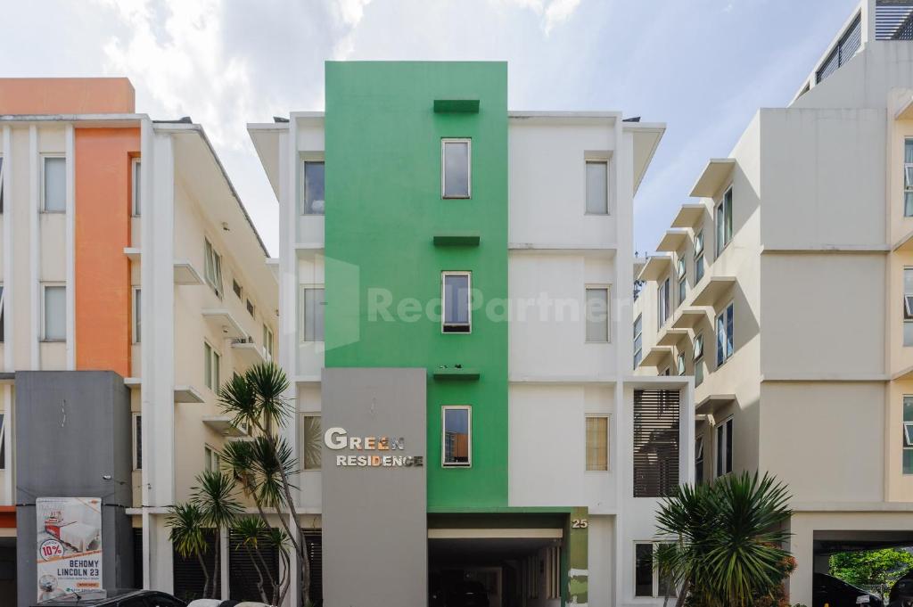 a building with a green and white building at Green Residence 25 Syariah Karawaci RedPartner in Tangerang