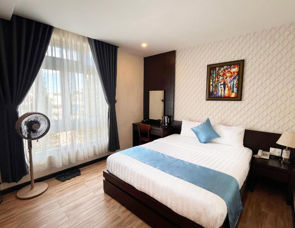 Giường trong phòng chung tại Thien Ly Hotel - Da Lat Center