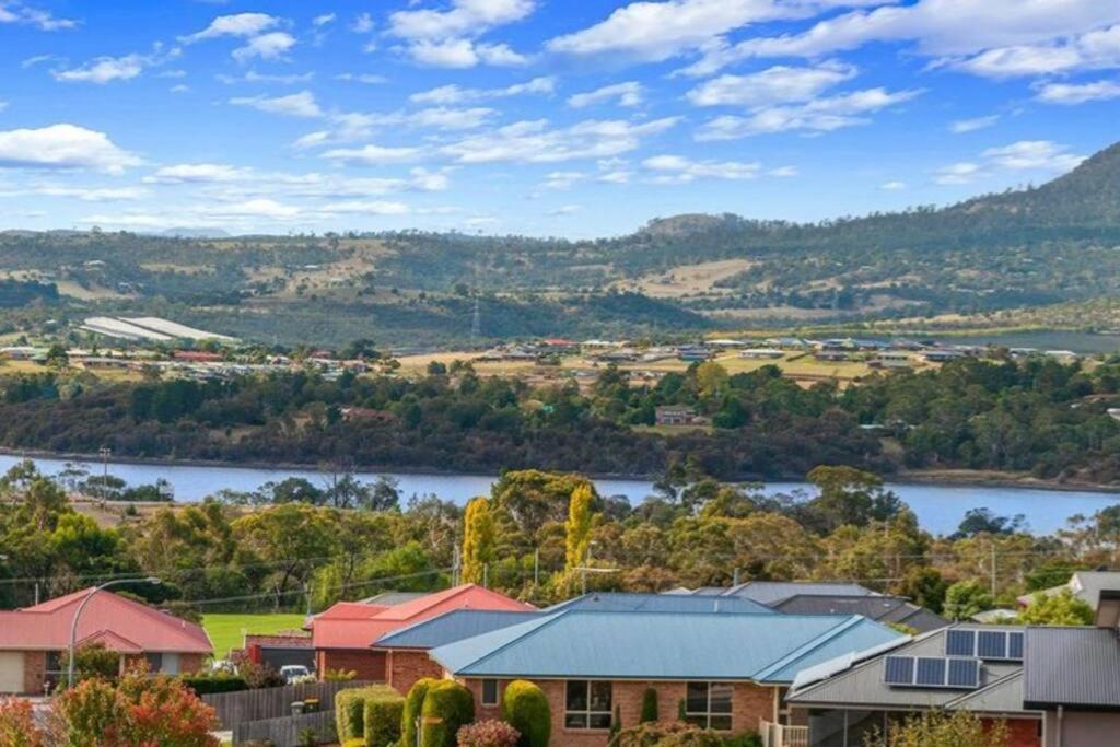a view of a town with a river and houses at Sunshine Apartment in Austins Ferry
