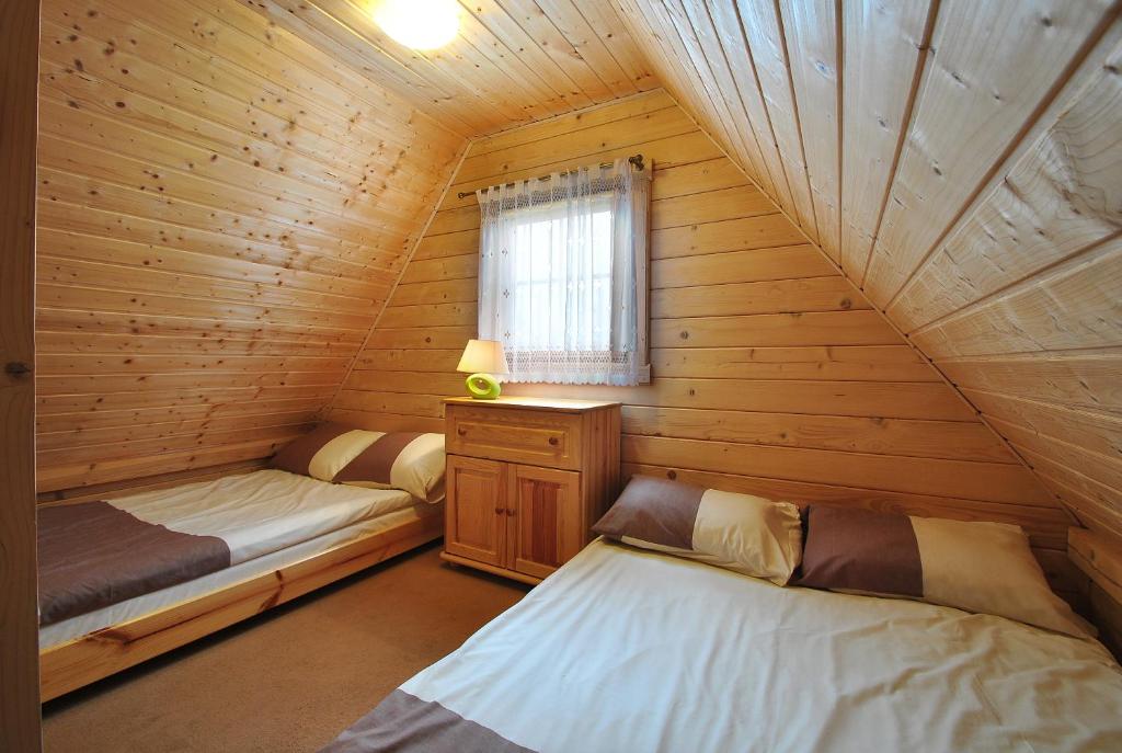Postel nebo postele na pokoji v ubytování Ranczo