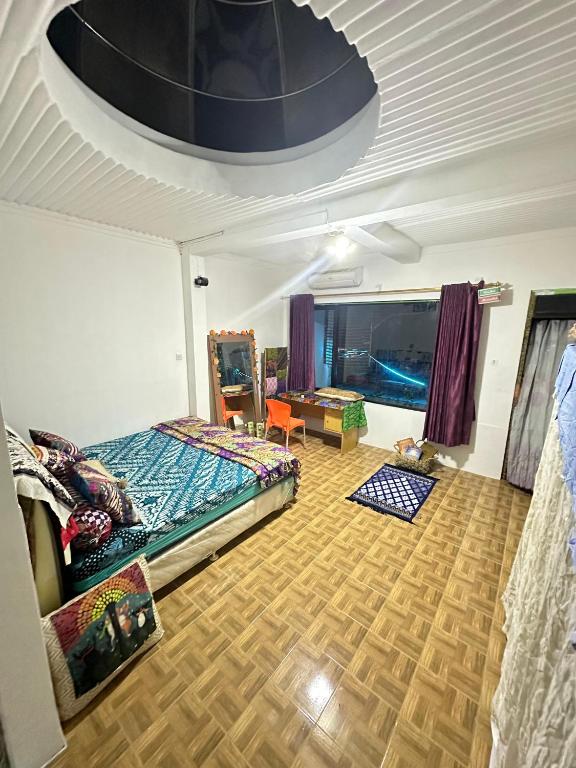 Postel nebo postele na pokoji v ubytování Pelemkecut Double-Degree Syariah Accommodation