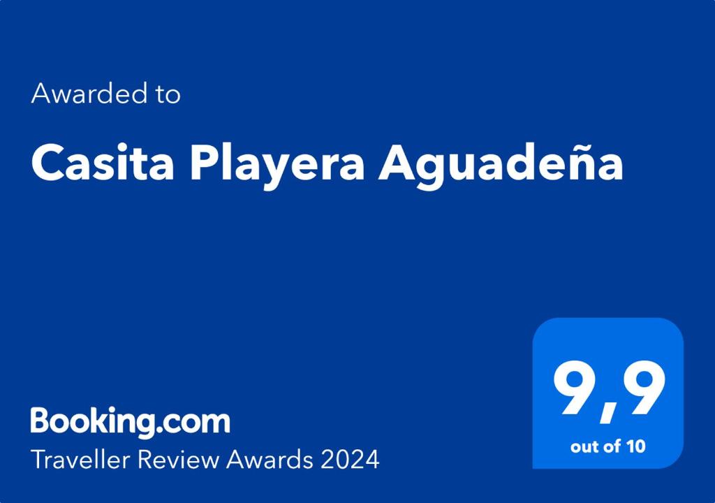 a blue sign with the words pasta player aquaria at Casita Playera Aguadeña 