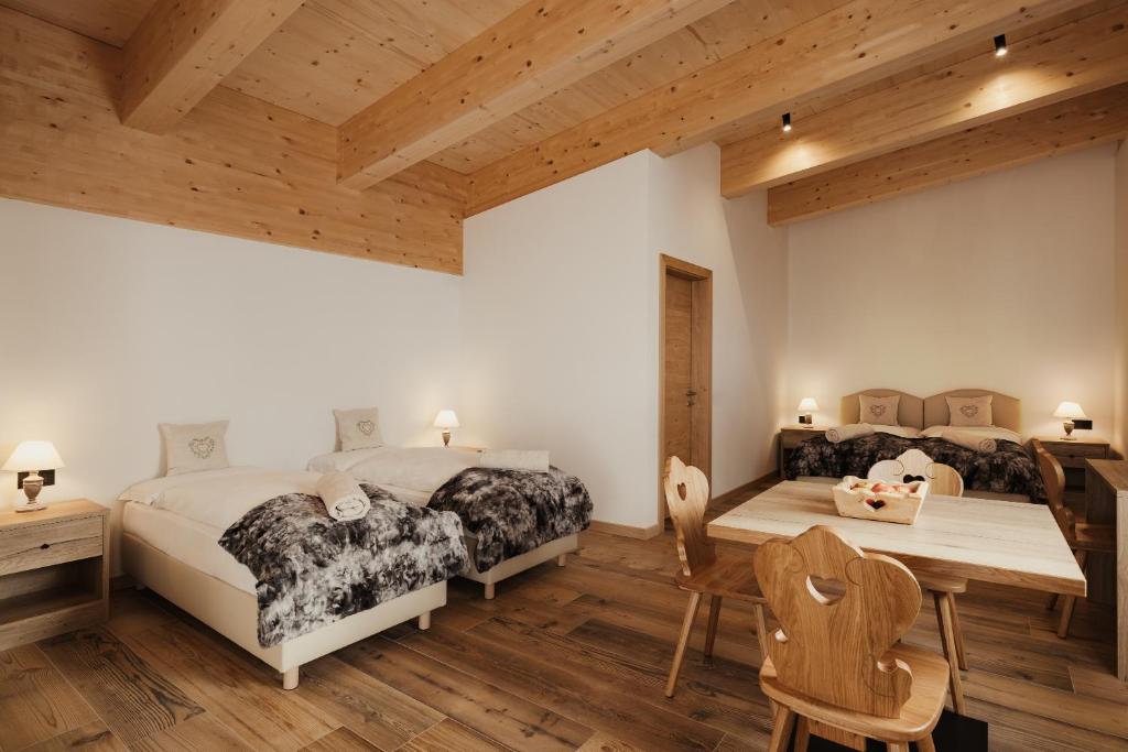 Postel nebo postele na pokoji v ubytování Hotel Monte Cherz