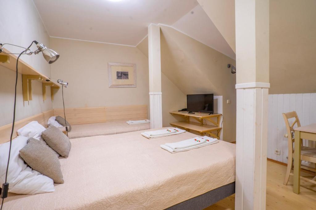 Postel nebo postele na pokoji v ubytování Kongo Hotel