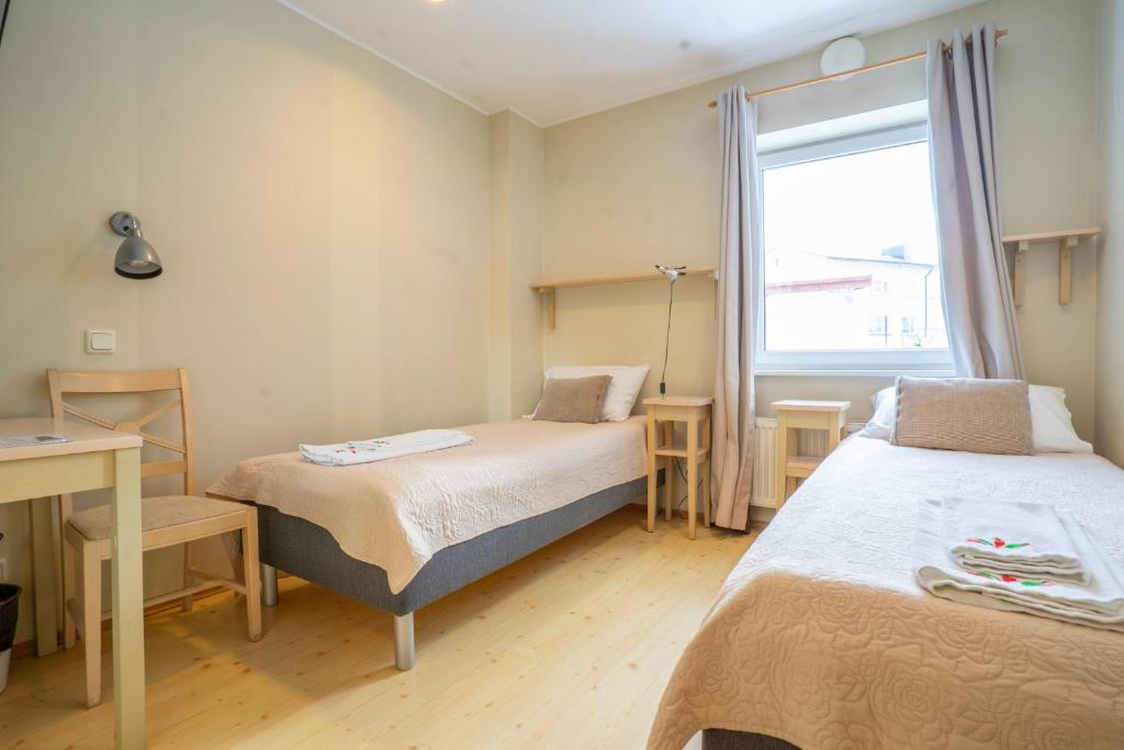 Postel nebo postele na pokoji v ubytování Kongo Hotel