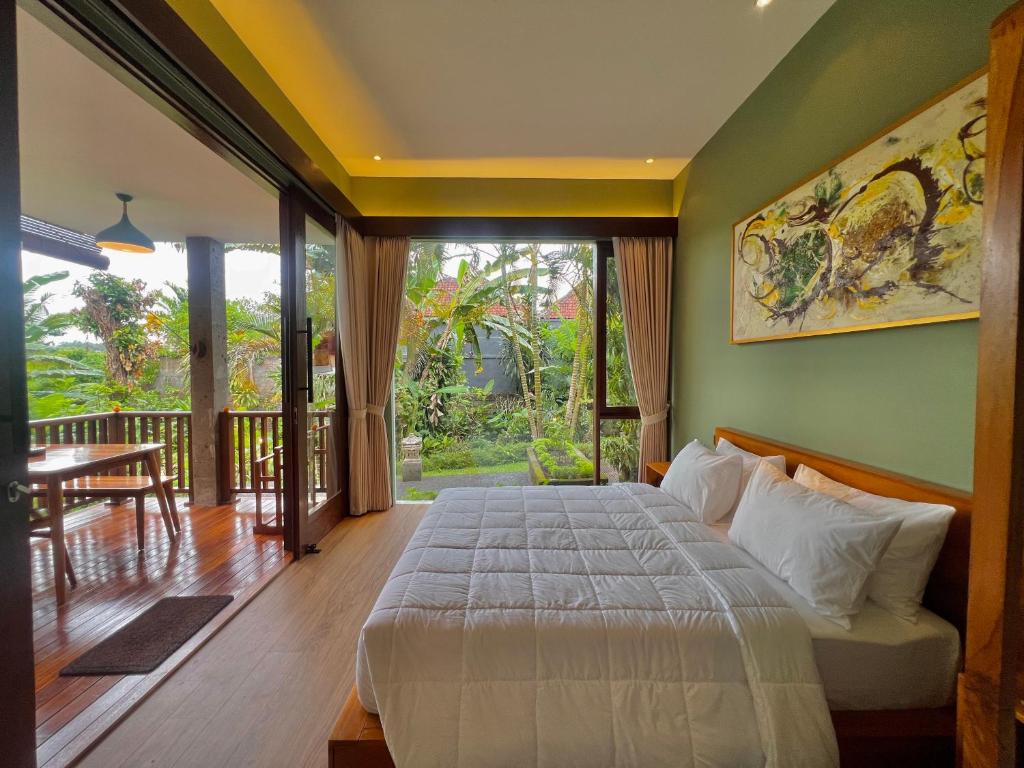 Postel nebo postele na pokoji v ubytování Ardan Maison Ubud