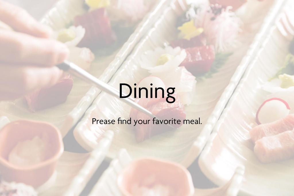 a person holding a spoon in a tray of food at Hida Takayama Onsen Takayama Green Hotel - KEIO GROUP HOTELS - in Takayama