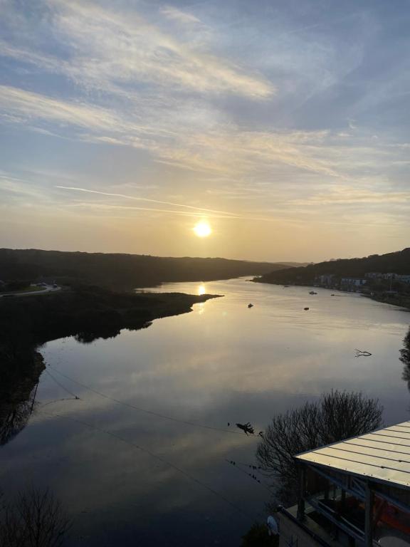 a view of a river with the sun setting at Apartment 2 @ Clifden Bay Apartments in Clifden