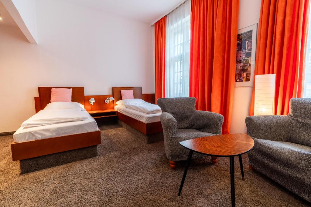Postel nebo postele na pokoji v ubytování Hotel Carlton Munich