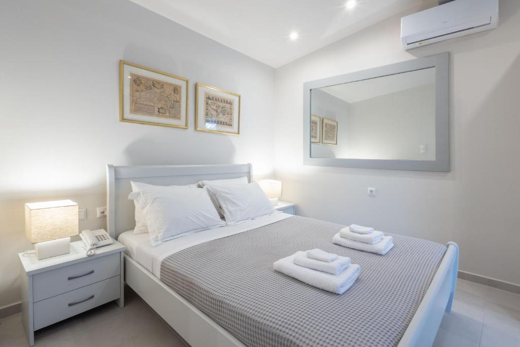 A bed or beds in a room at Vineyard Estate