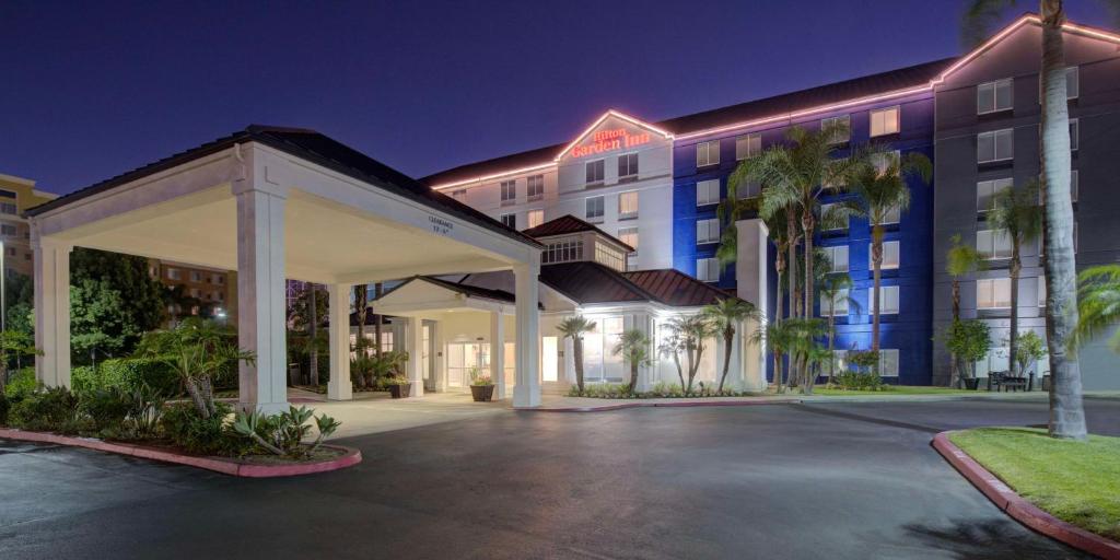 a rendering of the front of a hotel at night at Hilton Garden Inn Anaheim/Garden Grove in Anaheim