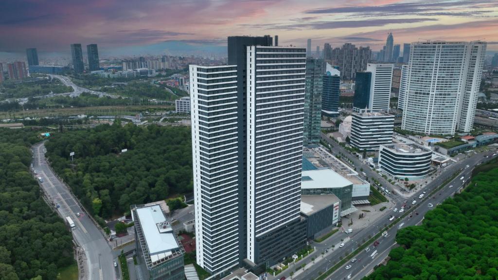 an aerial view of a tall building in a city at Fraser Place Antasya Istanbul in Istanbul