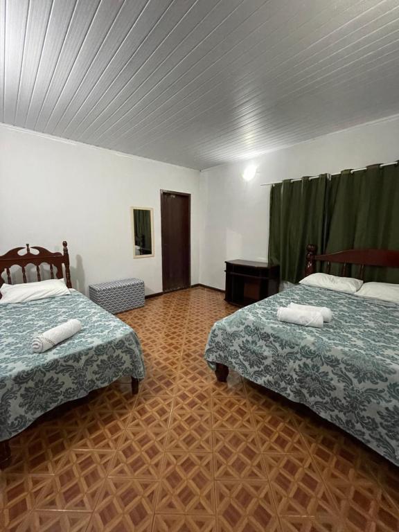 Postel nebo postele na pokoji v ubytování Pousada Recanto dos Sonhos