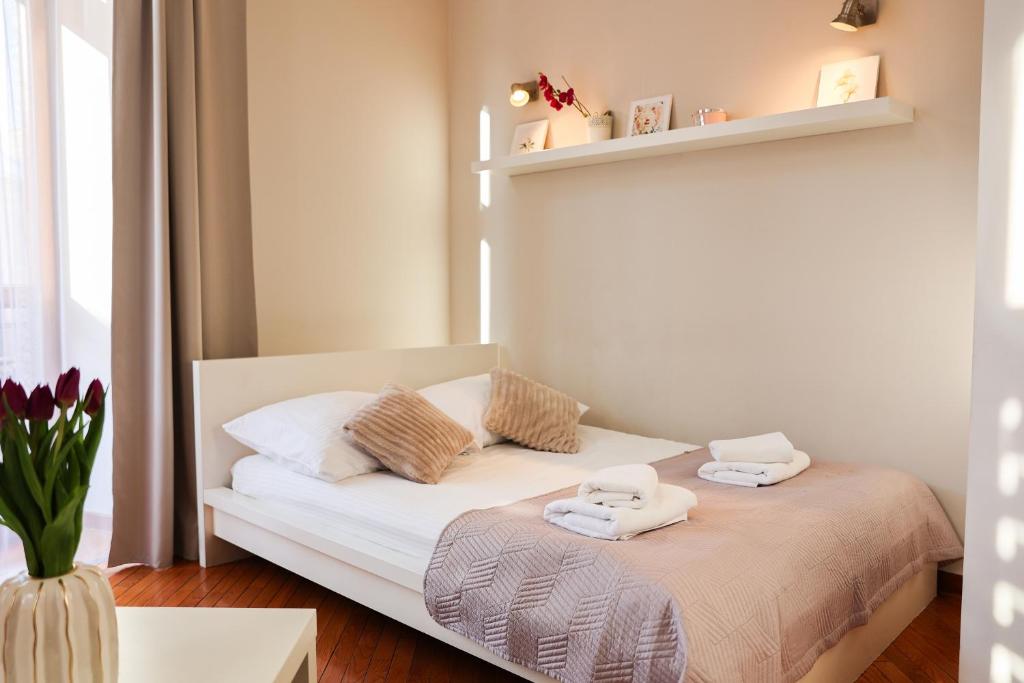 Postel nebo postele na pokoji v ubytování Apartamenty Przemyśl