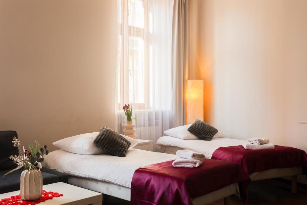 Postel nebo postele na pokoji v ubytování Apartamenty Przemyśl