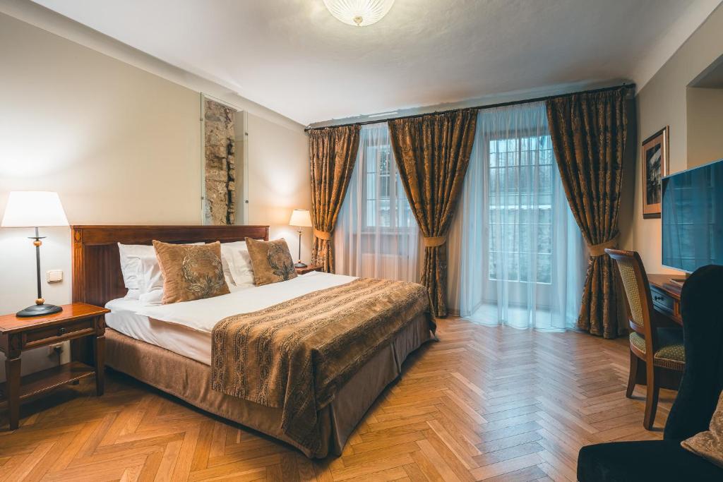 Łóżko lub łóżka w pokoju w obiekcie Appia Hotel Residences