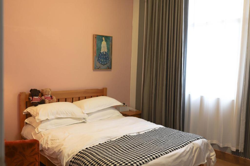 Tempat tidur dalam kamar di Changsha Fuxiangyuan International Hostel