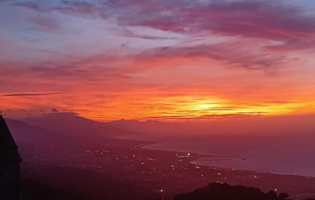 a sunset from the top of a mountain at 1 Bedroom Lovely Apartment In San Piero Patti in San Piero Patti