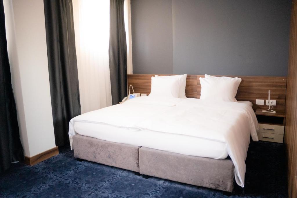 Postel nebo postele na pokoji v ubytování Olivia Rooms