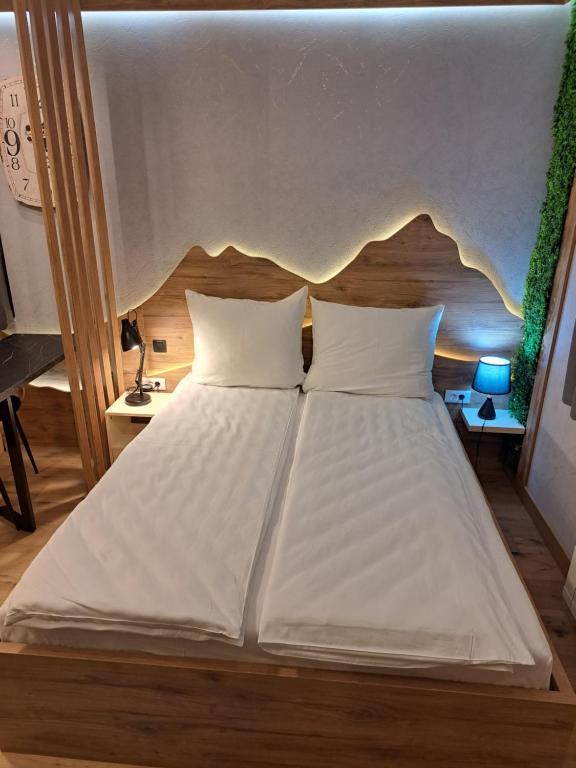 Postel nebo postele na pokoji v ubytování Aparthotel Vucko Jahorina NEW 451
