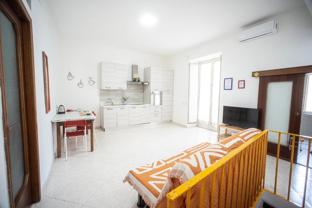 Et tv og/eller underholdning på Appartamento In Piazza