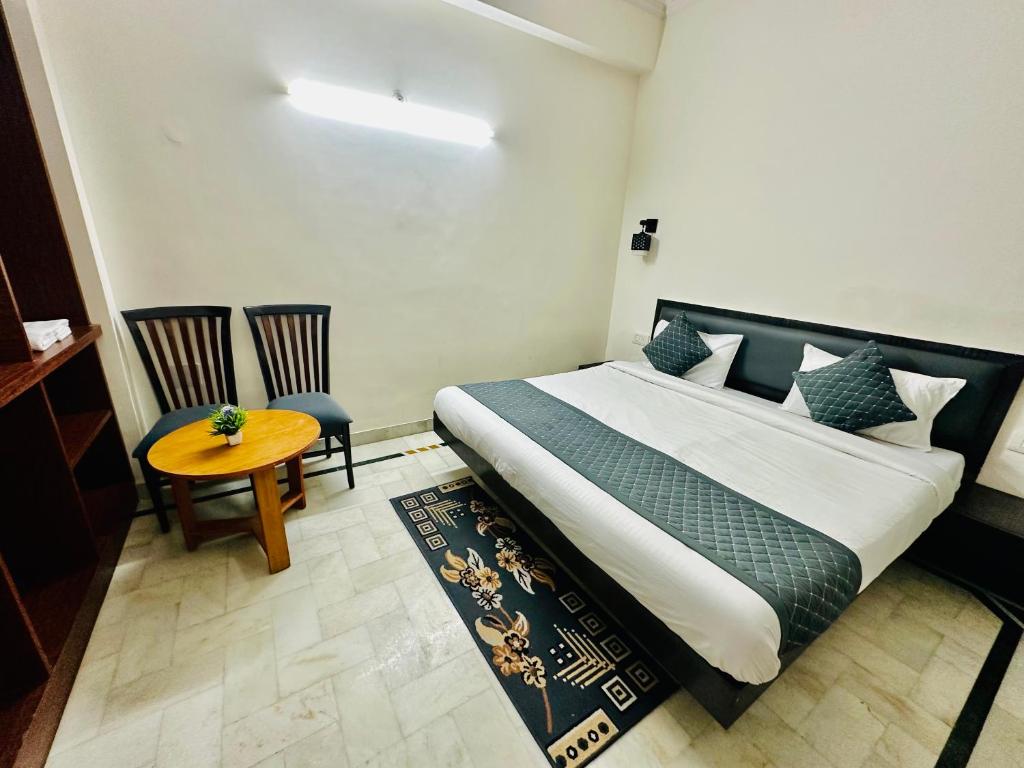 Postel nebo postele na pokoji v ubytování Sheela Homestay