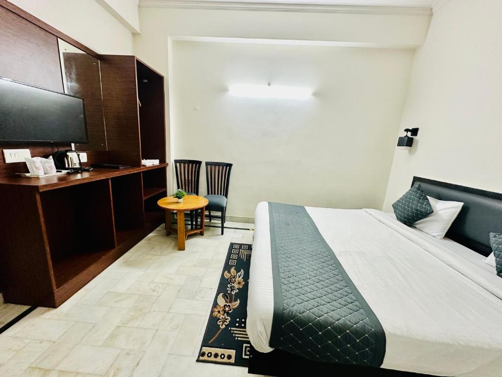 Postel nebo postele na pokoji v ubytování Sheela Homestay