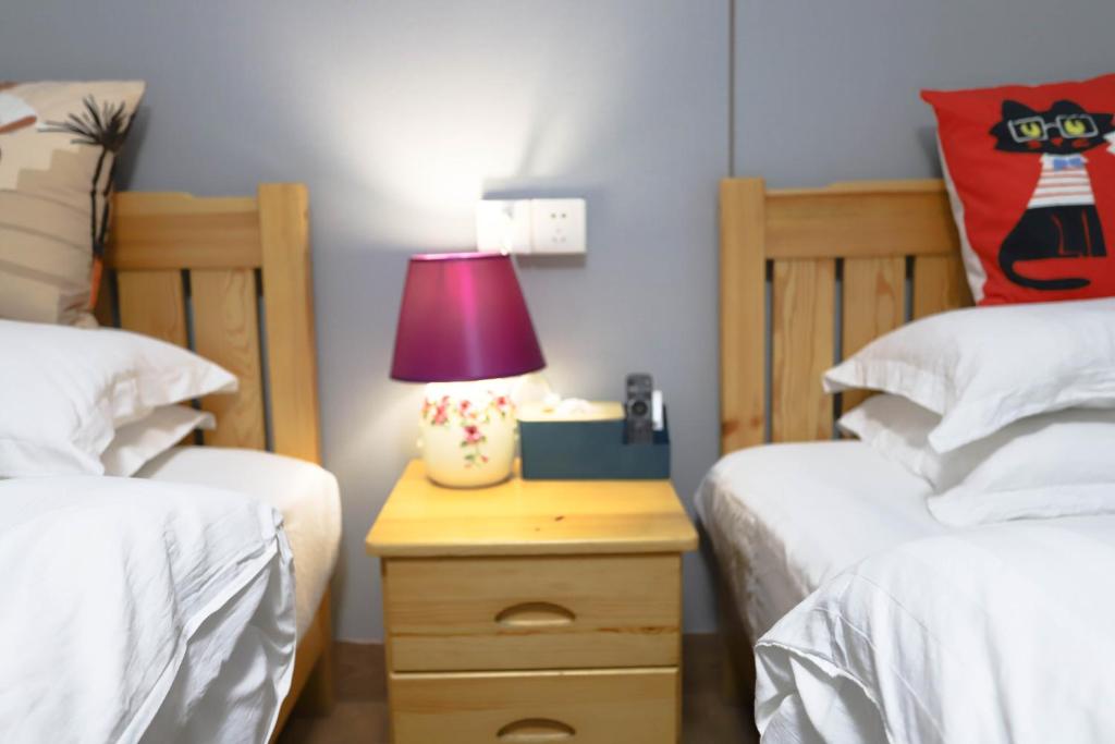 Tempat tidur dalam kamar di Changsha Fuxiangyuan International Hostel
