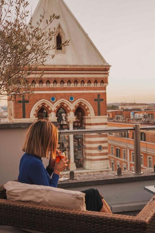 Un balcón o terraza de La Griffe Hotel Roma
