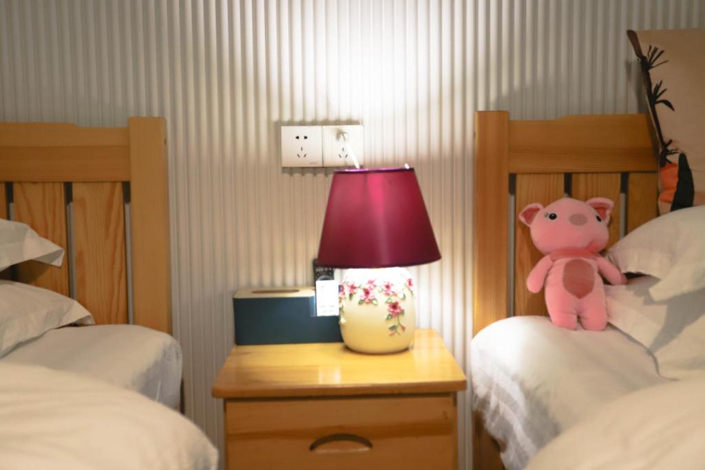 Tempat tidur dalam kamar di Changsha Fuxiangyuan International Hostel