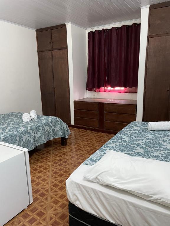 Postel nebo postele na pokoji v ubytování Pousada Recanto dos Sonhos