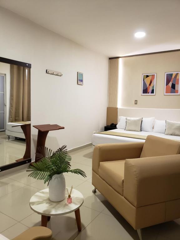 Posezení v ubytování Hotel Suite Center Pereira
