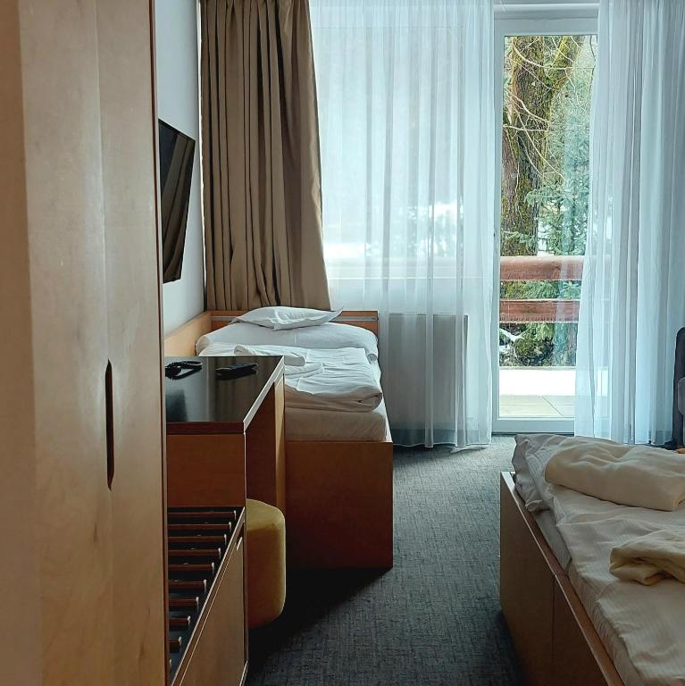 Postel nebo postele na pokoji v ubytování Hotel Diery