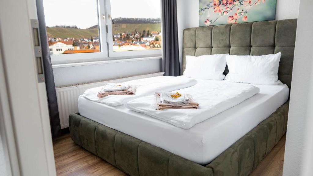 Postel nebo postele na pokoji v ubytování E&B Apartments Korb