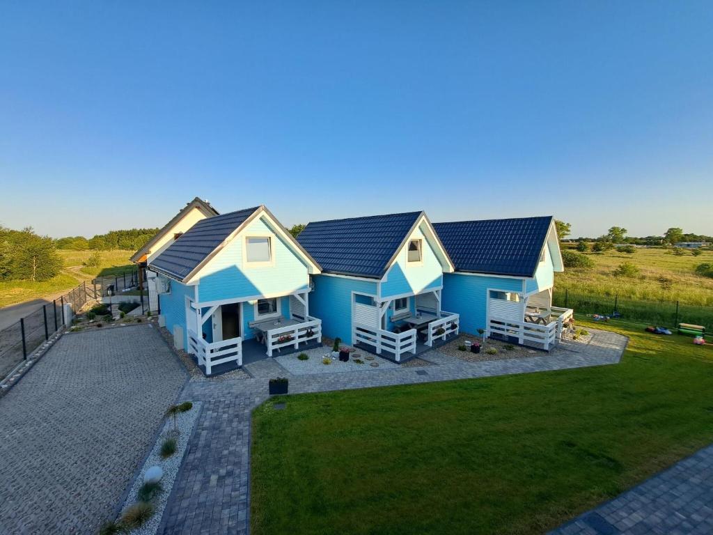 an overhead view of a house with blue at Comfortable holiday homes for 6 people, Niechorze in Niechorze