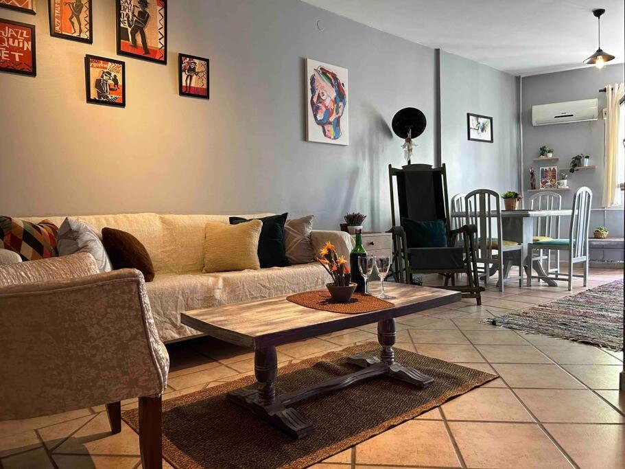 a living room with a couch and a table at Cosy house in amazing location. Kadikoy Moda 2BR in Istanbul