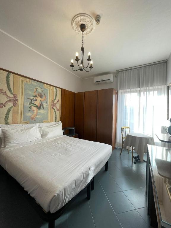 A bed or beds in a room at Hotel La Bussola